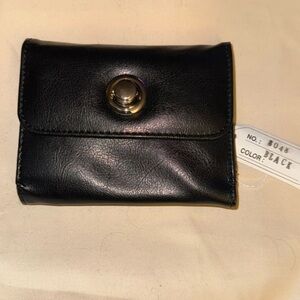 New with tags, black leather women’s wallet, six card slots, two money sleeves​